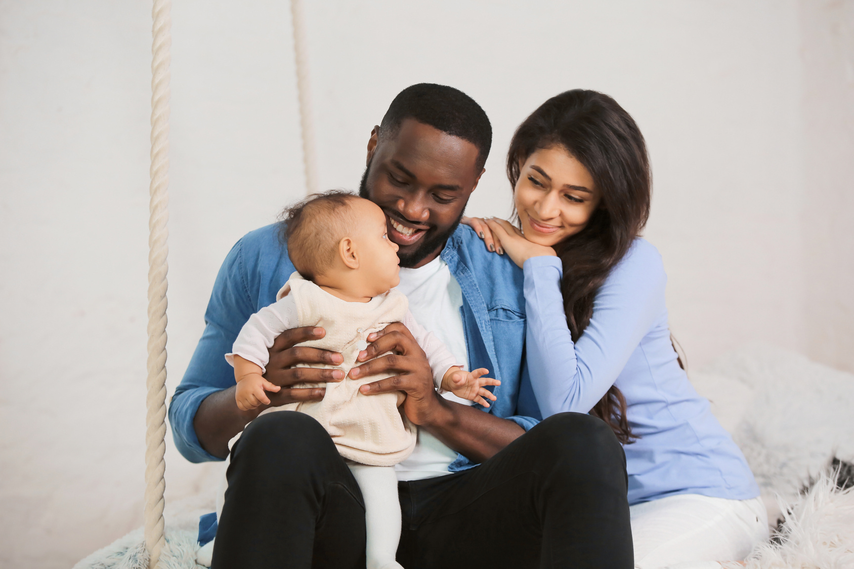 Cute Baby with Parents at Home